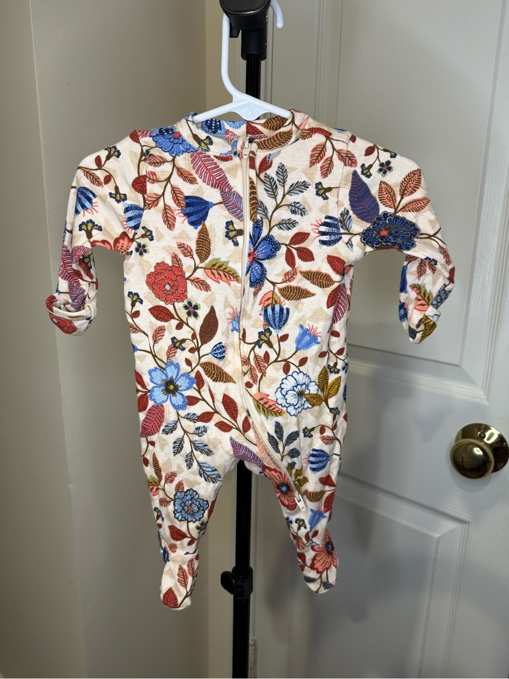 Old Navy Cream Floral Zip-Up Footed One-Piece with Blue and Red Accents